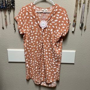 Cute, flowy, t-shirt style dress. 100%Polyester.